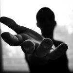 Help - Man's Hand in Shallow Focus and Grayscale Photography